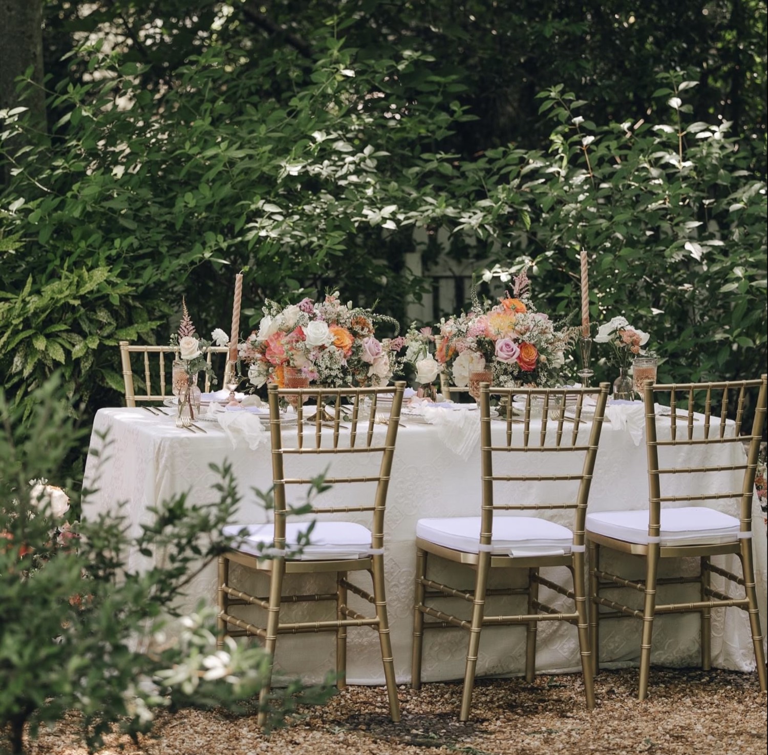 Gold chiavari chairs at a garden reception