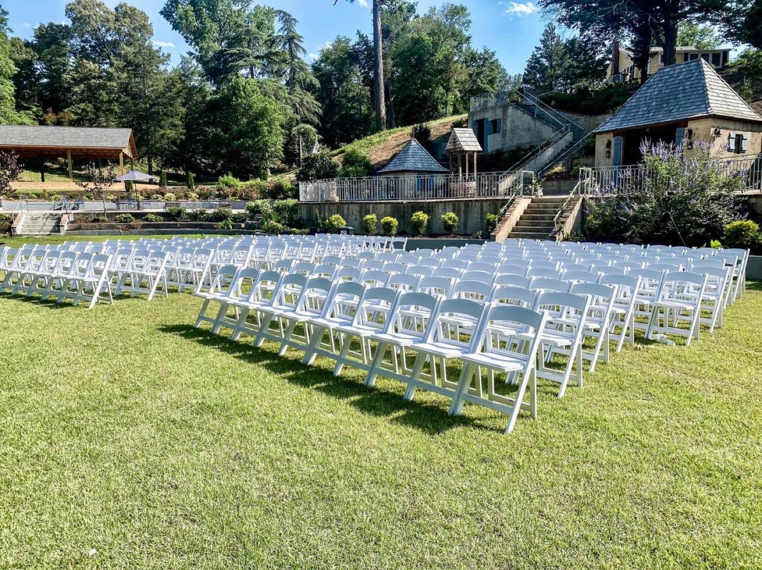 White garden chairs set for a ceremony